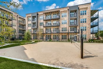 Sand volleyball court and walking paths for outdoor fitness